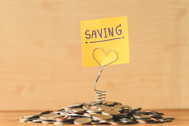 Saving heart-shaped coins representing ethical and socially responsible tax planning